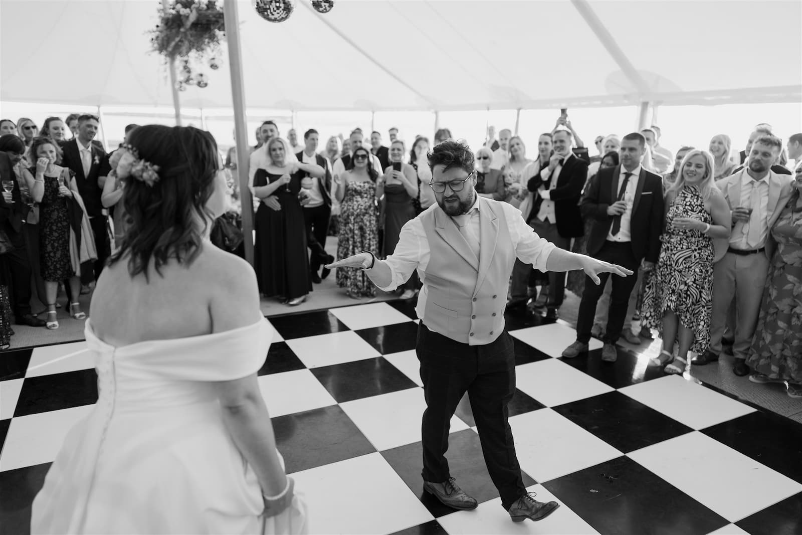 dancing on checkered dancefloor